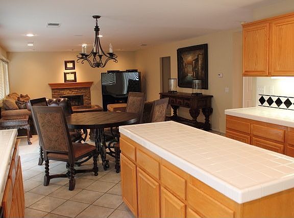 Kitchen with Lighting Under the Cabinets, Island and Walk In Pantry