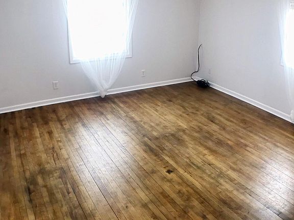 Large living room with hardwood floors.