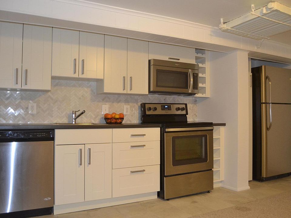 Kitchen is open concept with full size appliances.