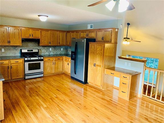 Kitchen with Stainless Steel Appliances and built in Desk