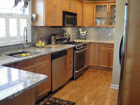 kitchen features gleaming granite countertops