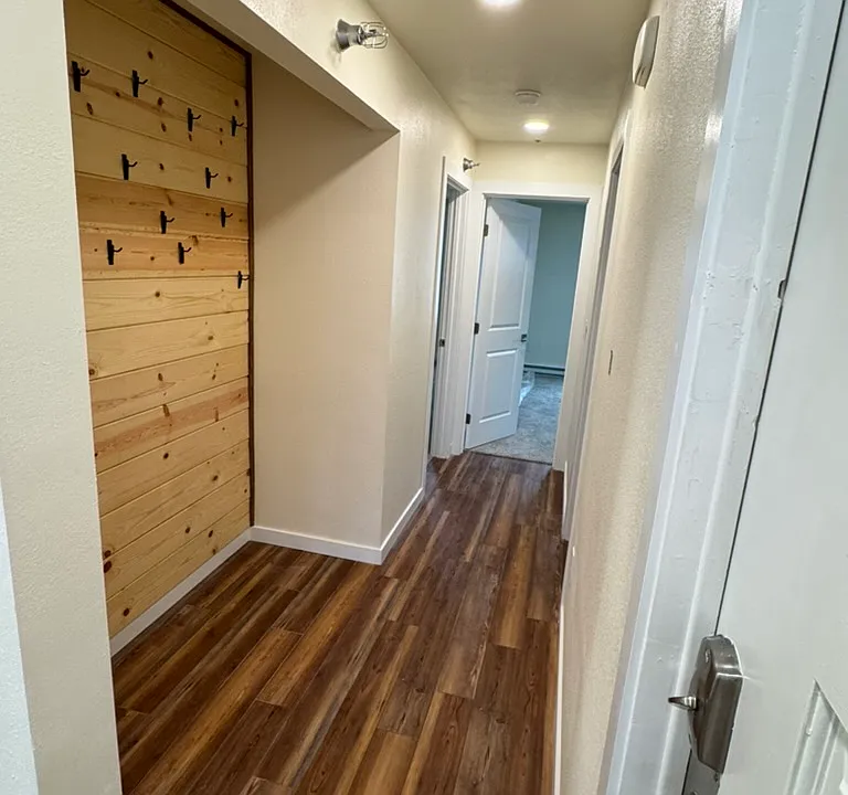 Hallway to the bedrooms, bathroom and closet alcove.
