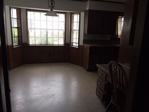 Bay window provides natural light for breakfast area in kitchen. Also to right is extra sitting area or computer workspace.