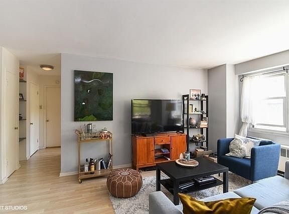 Living Room and hallway with storage