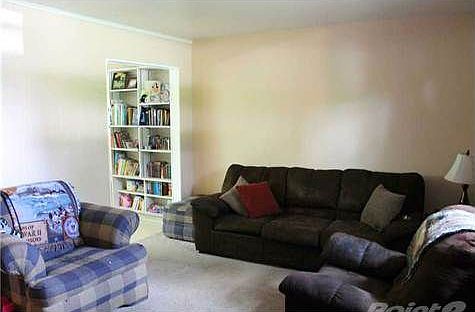 Cozy living area with large window to let in natural light.