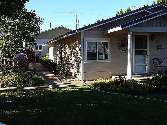 Side yard. Shop in back