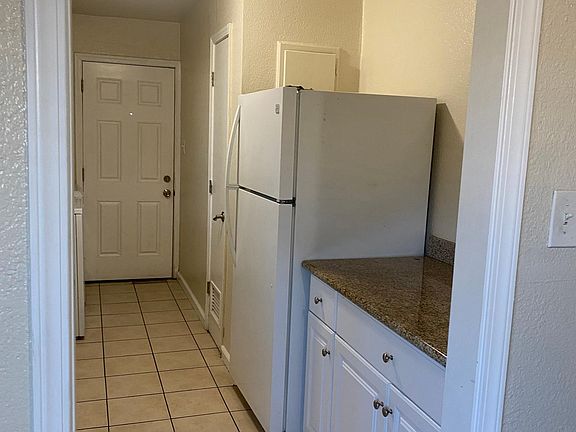Additional counter space with a refrigerator.