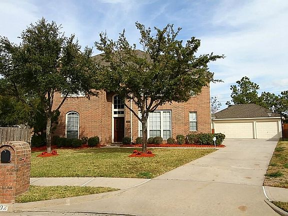 3 car garage is detached and set back from home on xtra large cul-de-sac lot.