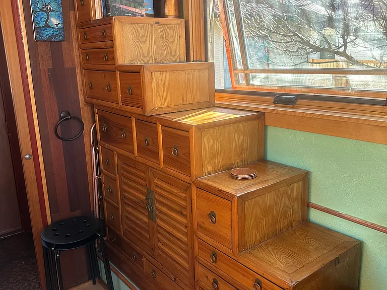 The Japanese tansu storage cabinet includes 18 drawers and a cupboard, providing a place for everything, so everything can be in its place!