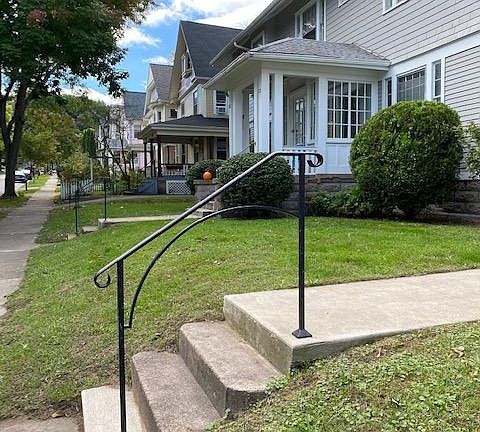 Looking south up Laburnam Crescent you see the well-maintained grounds of the property.