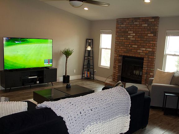Living Room with Wood Burning Fire Place.