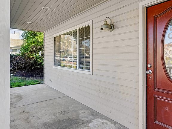 3__ Front Door / Entry Porch
Covered front entry with a solid wood door.