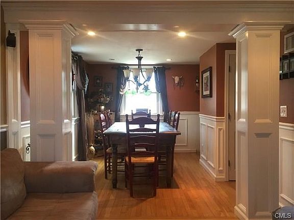 Open Concept Dining Room w/Custom Paneling, Pillars, Hardwood Floor