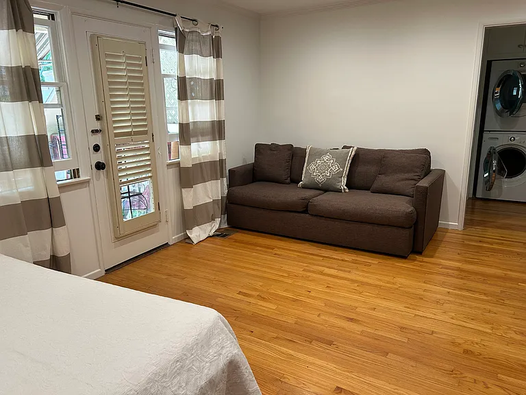 Second bedroom/office/TV room leads to laundry and second bathroom. Backdoor opens onto patio garden.