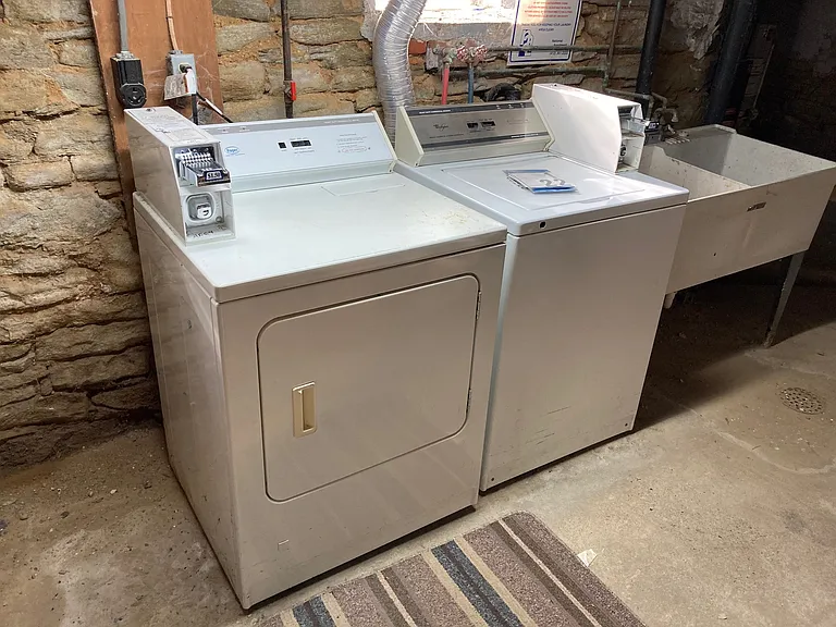 coin op laundry in basement