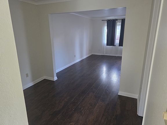 View of dining room and living room from kitchen