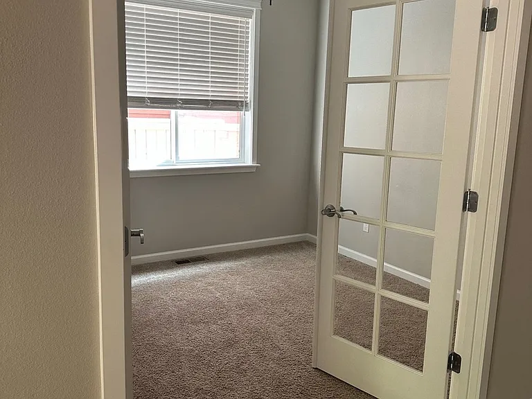 Downstairs room- multiple purpose space: office, play room, guest room, craft room.