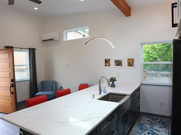 Open concept, vaulted ceilings, skylights, new quartz countertops, and all new appliances!