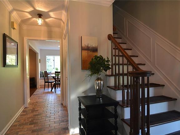 Spacious foyer with beautiful redone tiled floors