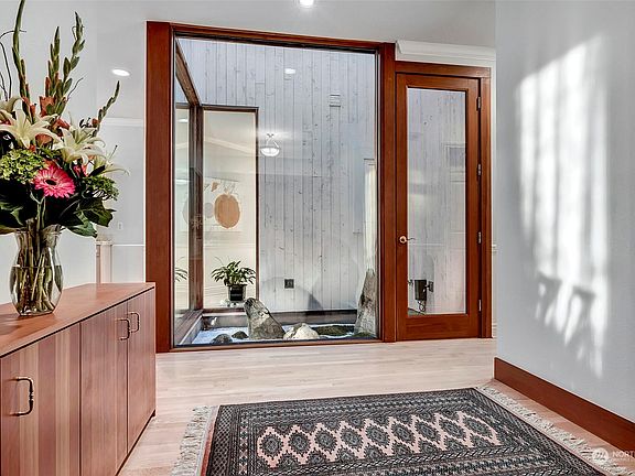 Enter through the grand double doors into the spacious entrance.>