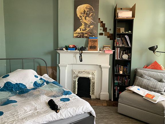 Master Bedroom with non working fireplace.