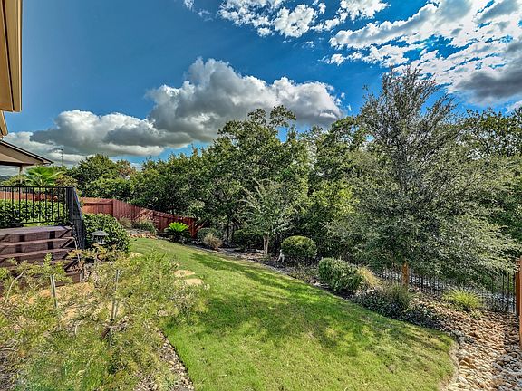 Private yard backs to trails