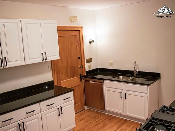 New sink and dishwasher. New cabinets. Door leads to back entrance.