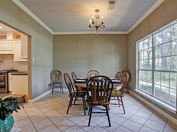 Formal dining conveniently located right off the kitchen for those large family gatherings with a great view of the front yard!