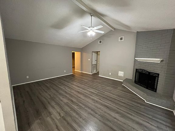 Large Living room with vaulted ceiling and fireplace.