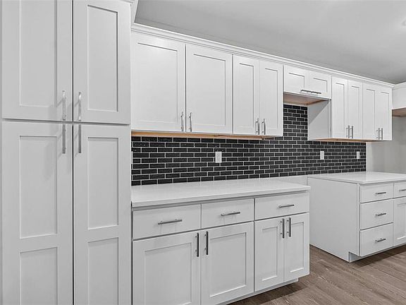 Plenty of cabinets, tile backsplash, stainless steel appliances to be added.
