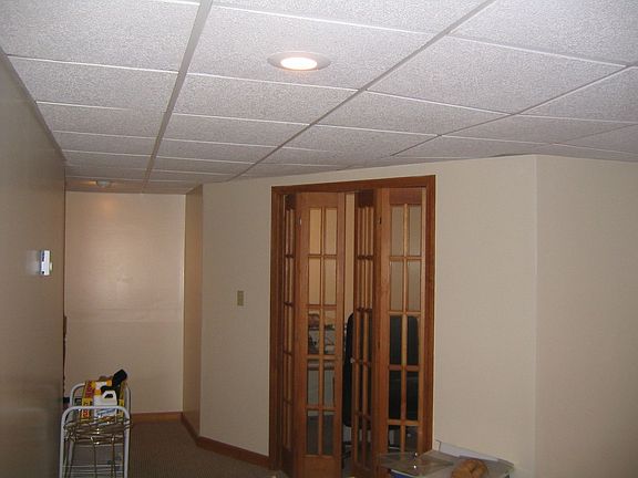 Finished basement with doors to the Office