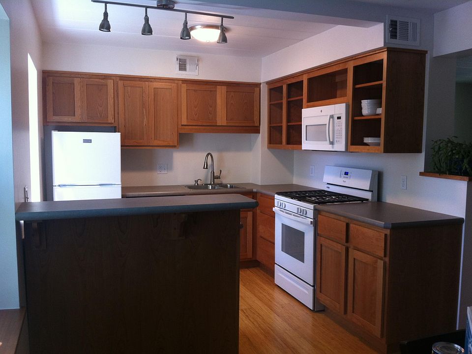 Open plan kitchen with custom cherry cabinets.