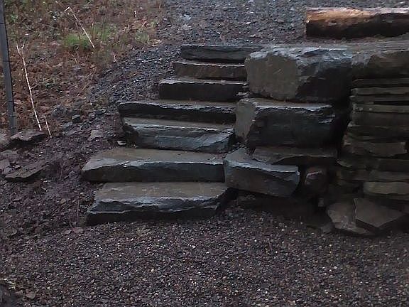 Stone work from fire pit to lakefront