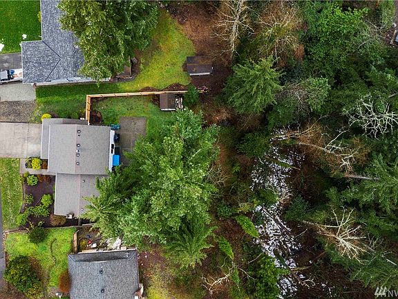 Partially fenced yard with patio and private greenbelt lot