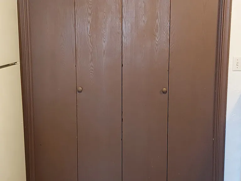 Utility room off kitchen with doors closed