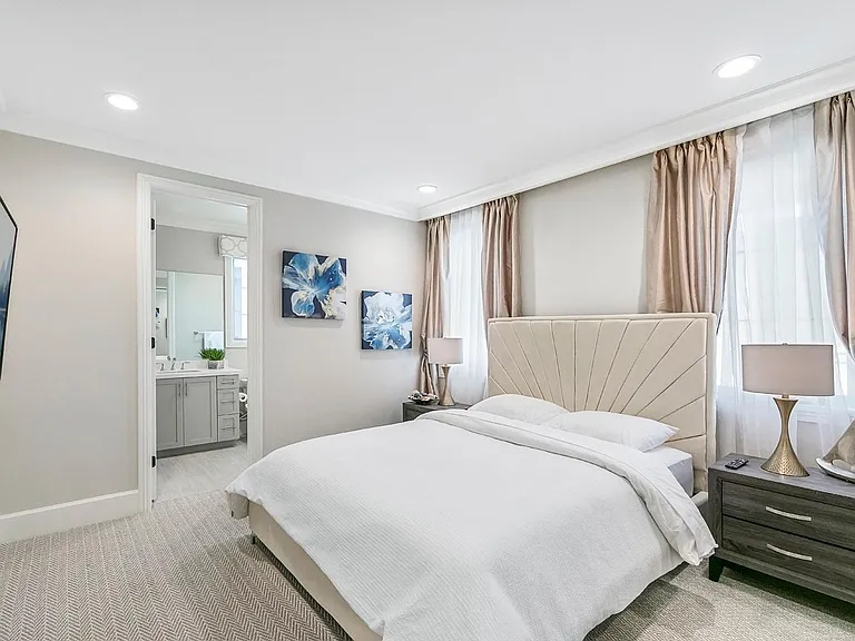 All the bedrooms have custom window treatments, custom crown molding and custom closets.