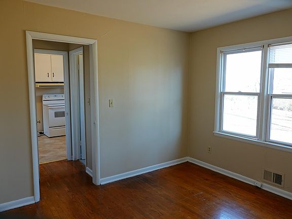 This room off the kitchen can be used as an office or bonus 