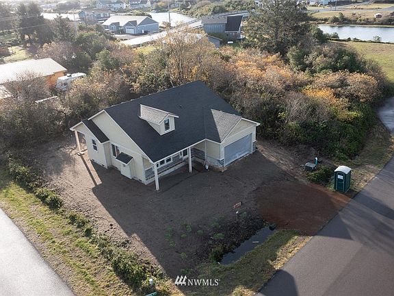 Located on a corner lot with a green belt for privacy.
