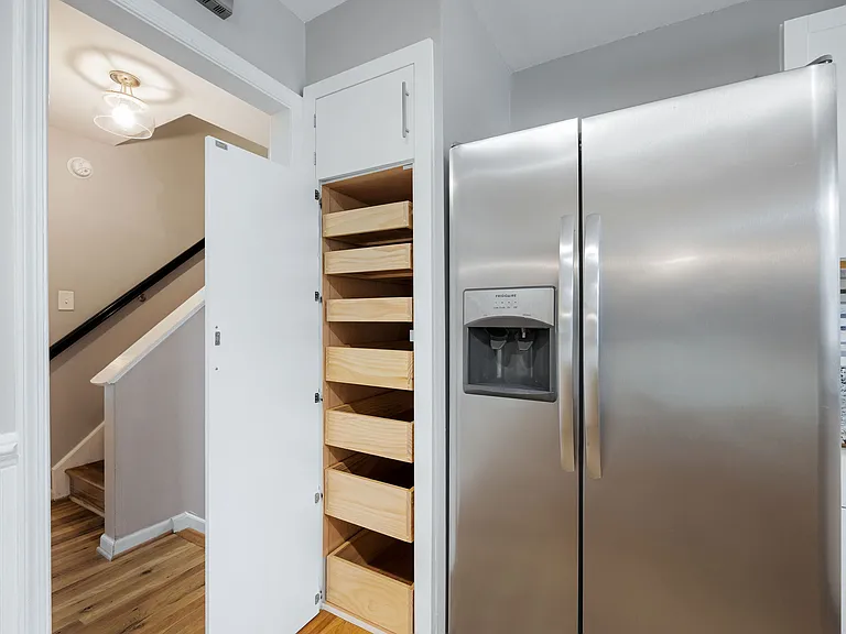Kitchen with pantry door open