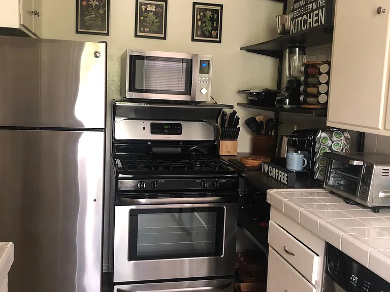 Stainless Steel appliances in kitchen: Fridge, Gas Range, Dishwasher,Microwave. Brand new cookware ,blender, mixer, panini maker, toaster oven, Keurig coffee maker and much more