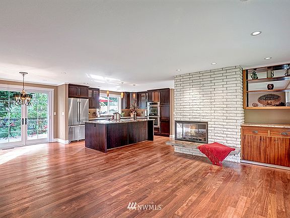 The Brazilian Hardwood flooring was just refinished/stained!  I'm sure you'll excuse that we ran out of time to stage for you. They are BEAUTIFUL!  French doors lead out to a stunning oversized deck complete with all the bells & whistles. Kitchen is an entertainers delight.  See you this weekend!