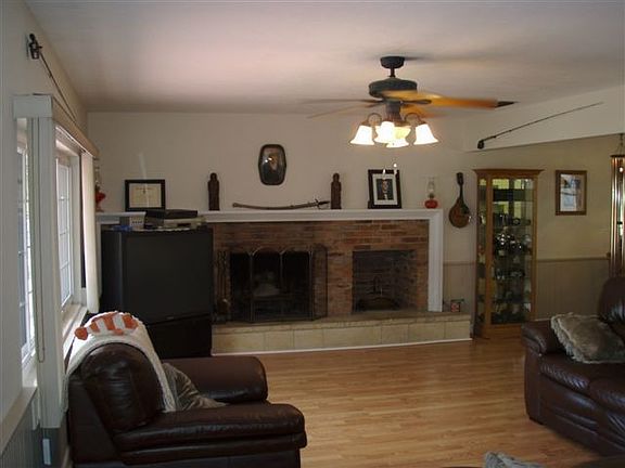 Living room with cozy wood burning fireplace