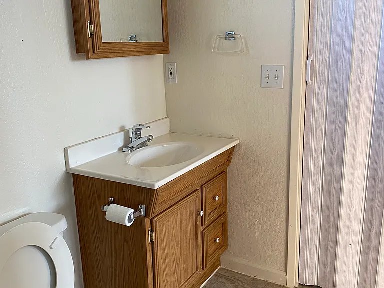 Private bathroom and a storage space for added convenience