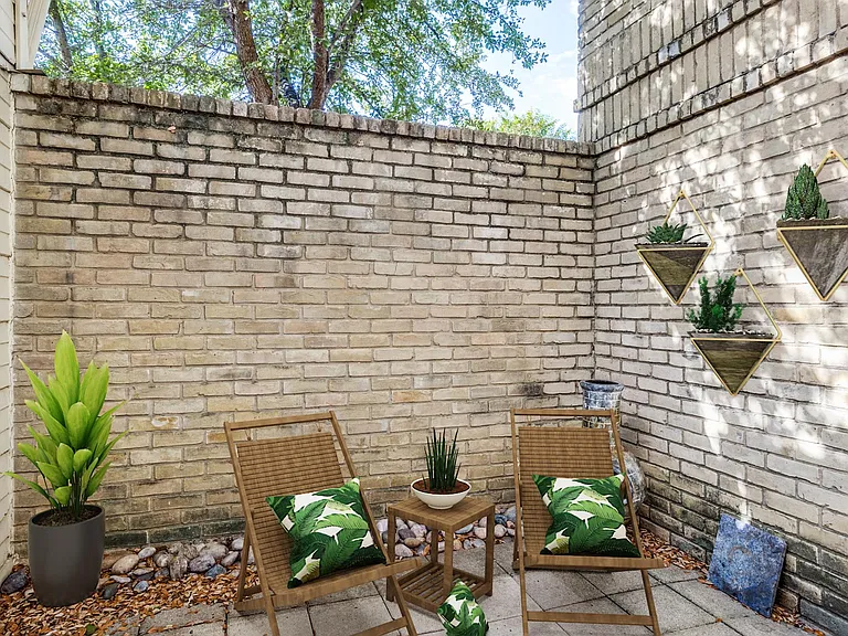 Enjoy coffee on your private courtyard patio (staged)
