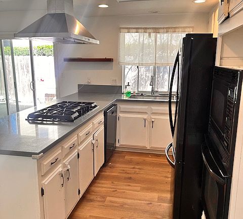 Laminate floors throughout
Skylight above