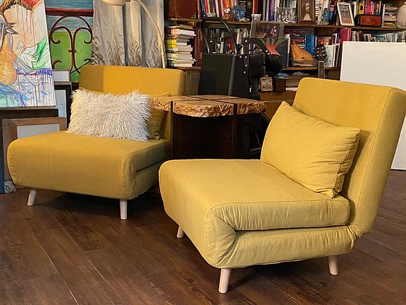 These chairs fold out into single beds for guests