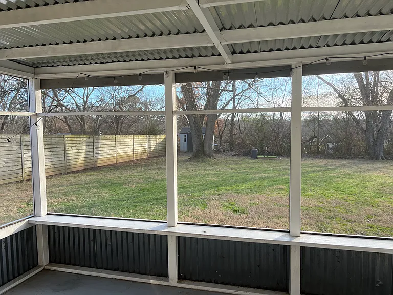Backyard with screened-in porch