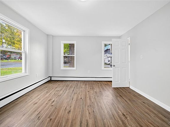 A versatile bonus room sits to the right as you en