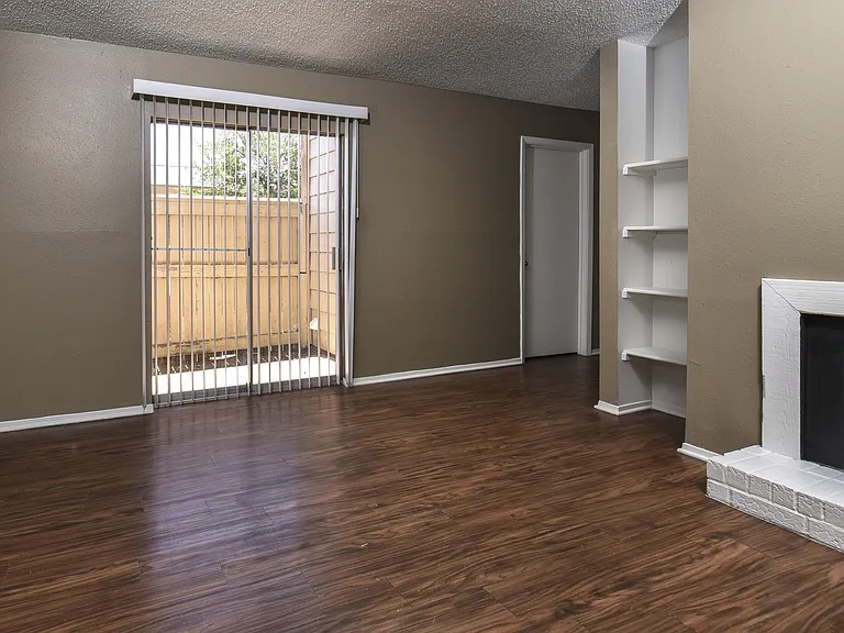 Classic - C Floor Plan Living Area with Fireplace with Plank Flooring