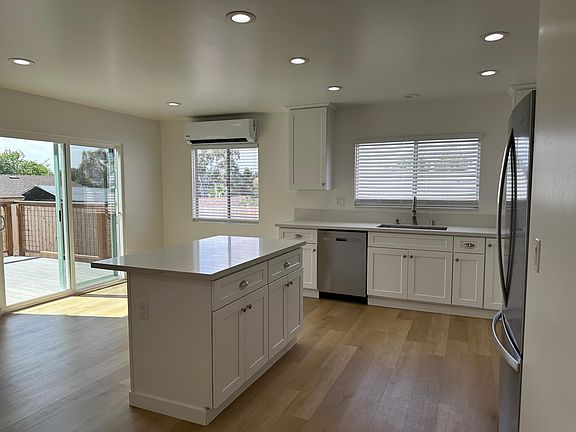 Raised deck outside of sliding door to deck and rear yard nice views! Very private!